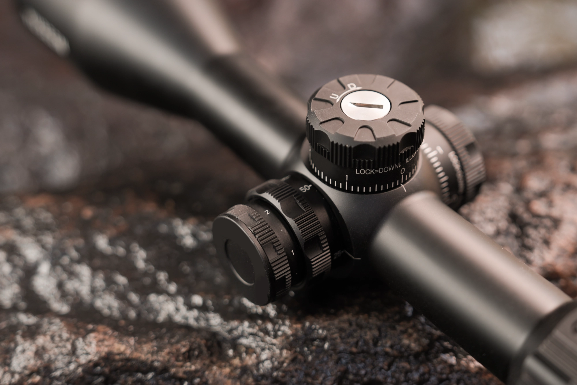 Close detail of the optical riflescope adjustment controls