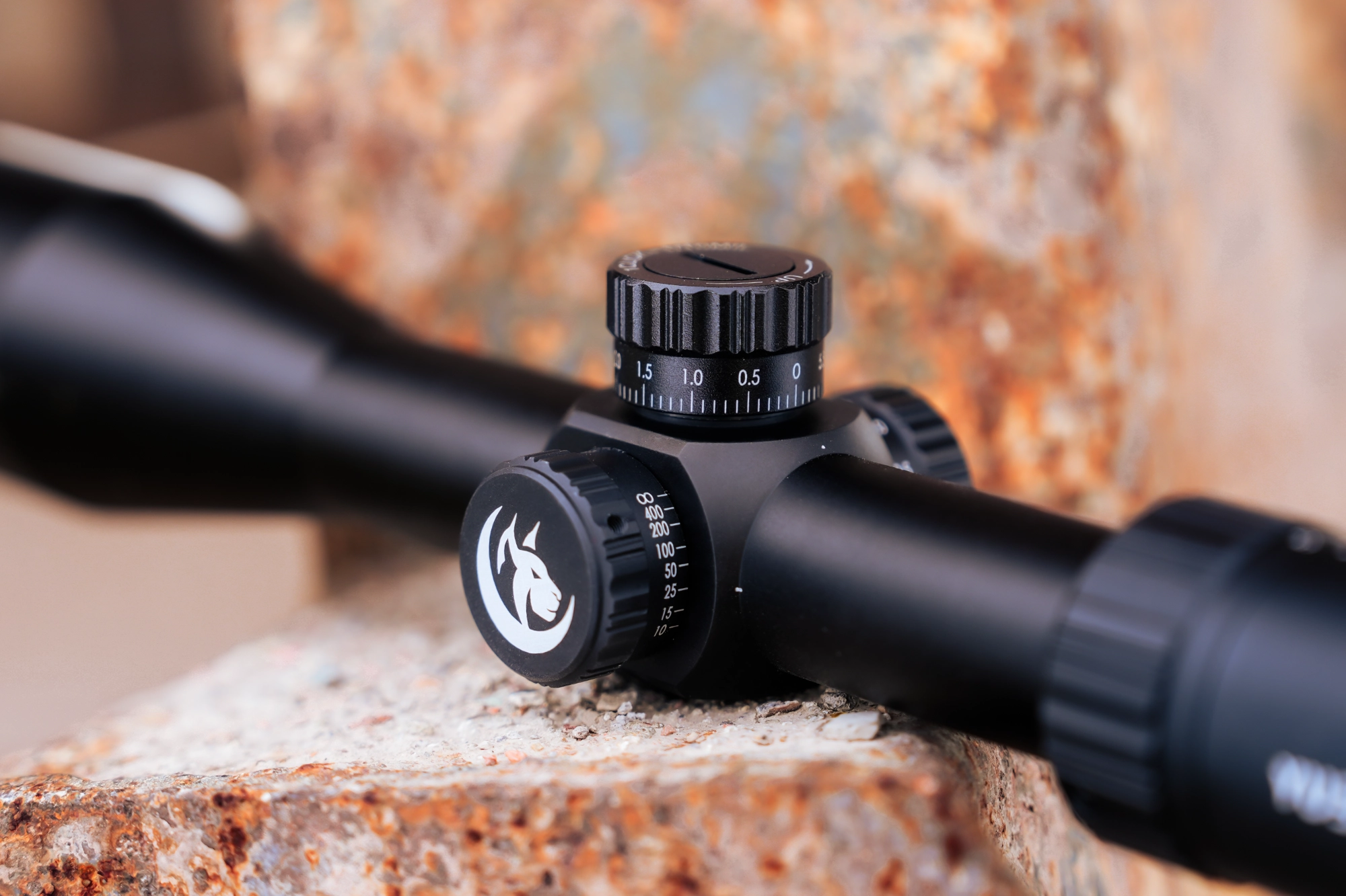 Close detail of the optical riflescope adjustment controls