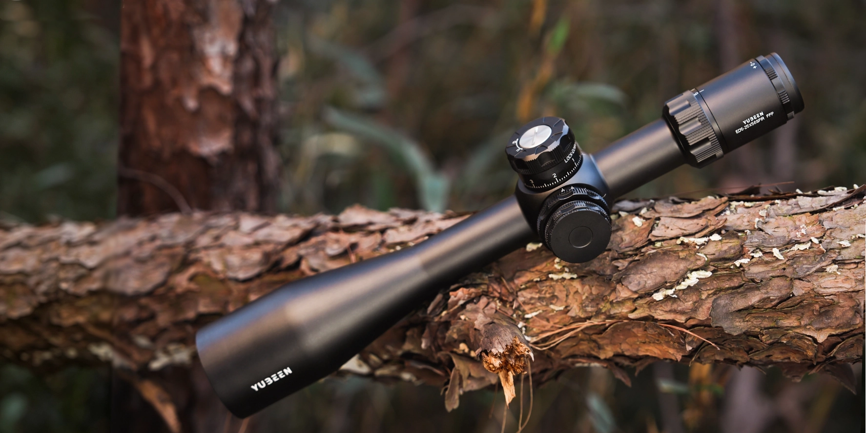 Yubeen optical riflescope photographed in a real-world outdoor environment