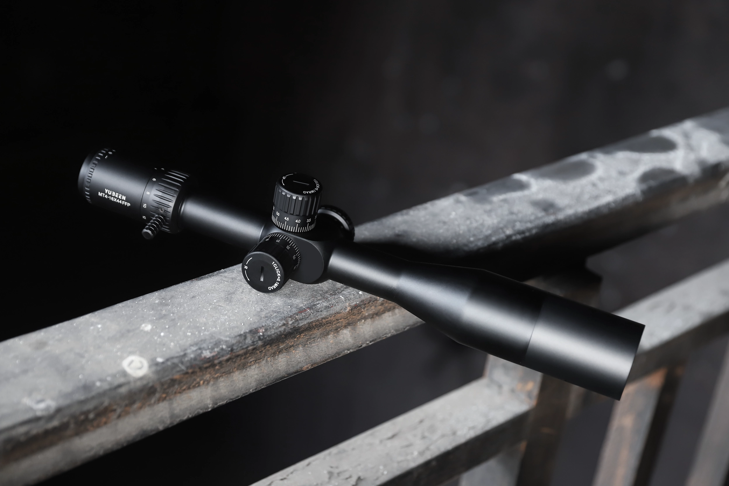Yubeen MT4-16×44 SF FFP riflescope mounted in an outdoor field environment