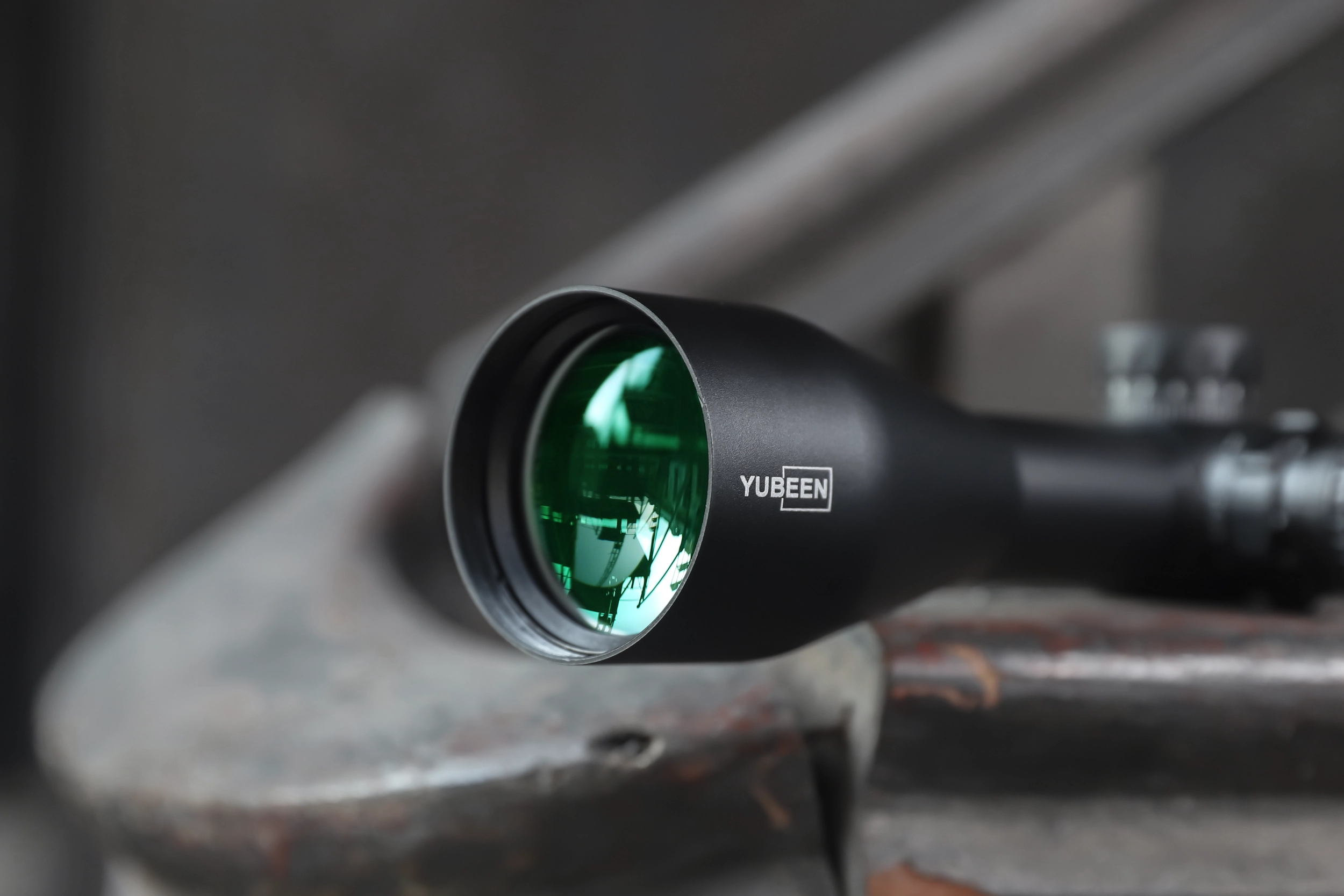 Close detail of the Yubeen VX3-18×50 SFIR objective lens