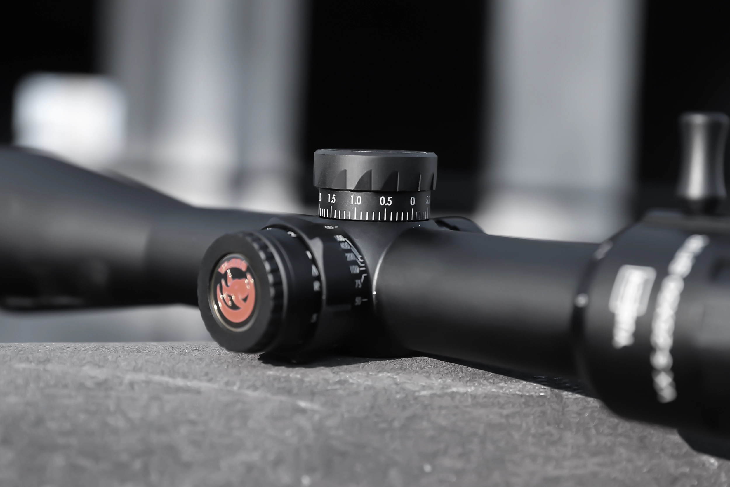 Close detail of the optical riflescope adjustment controls